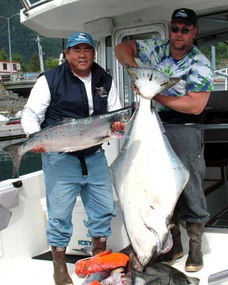 Mike Keating (r.) with a good-sized halibut caught near Sitka